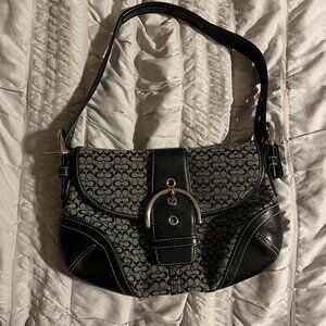 vintage Coach Soho Flap bag in signature jacquard and black leather.